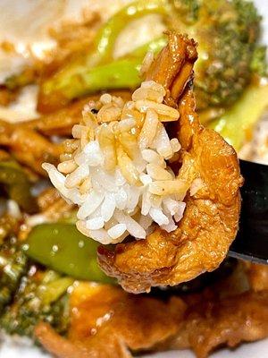 Sa cha chicken over white rice - tender sliced chicken, snow peas, green peppers, broccoli and baby corn in sa cha sauce - takeout