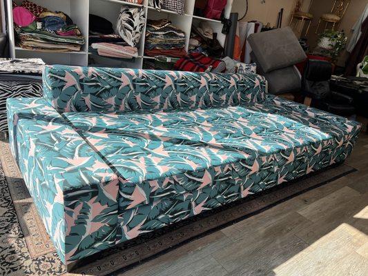 Custom outdoor sofa recovered in sumbrella fabric