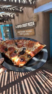 Two slices of pepperoni and olive pizza.