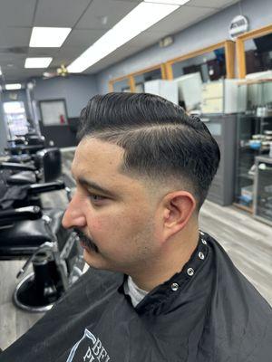 Low skin fade with hard part