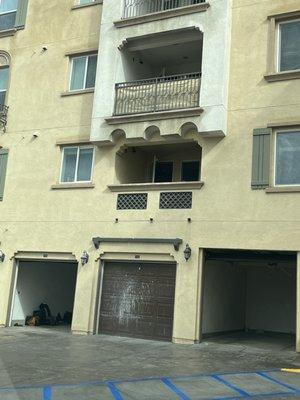 Not sure but looks like some water damage to the building. Management doesn't even bother to clean the garage to make it less obvious.