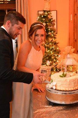 The bride & groom cut their wedding cake in the Maple Room Restaurant.