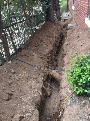 Sewer line replacement during and after replacement with landscaping restored