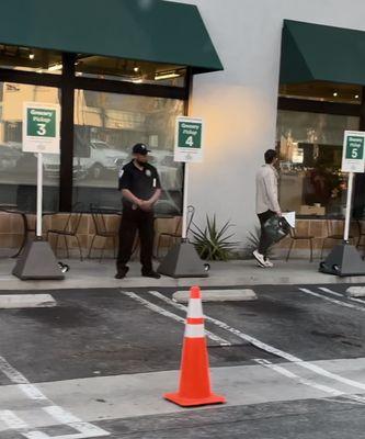 "Security guard" guarding spots for prime pickup and won't let prime users use them!