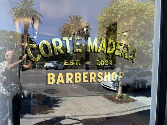 Gorgeous hand-painted gold leaf window sign. A portent of the classy Barbers inside!