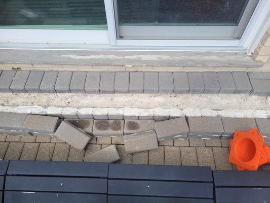 Pavers falling off concrete step 
 Concrete is falling apart so they cannot be glued back down