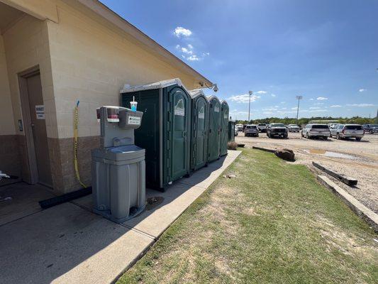 These "temporary" facilities have been there for a few years. None seem to be serviced regularly and the smell in this photo is atrocious!