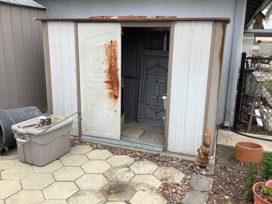 Before, old rusty shed with broken door