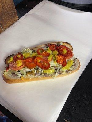 Large roast beef sub with hot peppers banana peppers