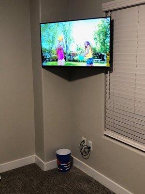 Flat screen installation with cord concealment.