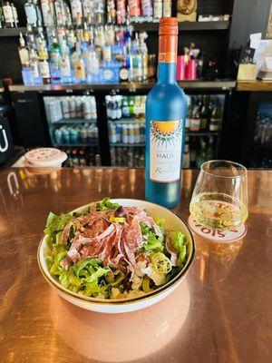 La Jolla salad is an upgraded Greek with charcuterie, here with a delicious crisp Reisling from Germany