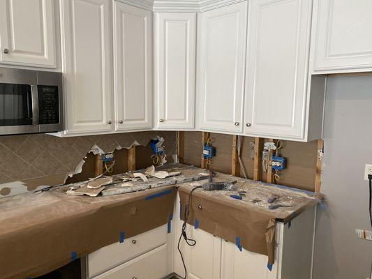 Demolition for kitchen remodel of backsplash and cabinet lighting