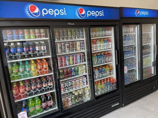 Brand new fridges filled with cold water, sodas, energy drinks, iced teas, coffee.