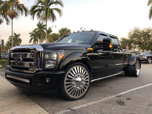 26 inch American force duly wheels with custom truck adapters on an F350 Ford