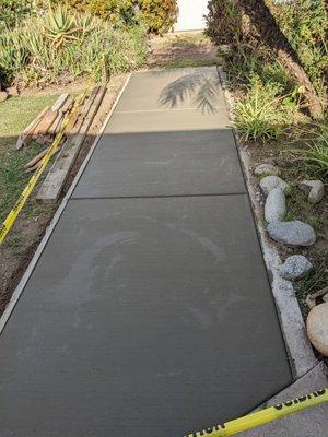 Concrete slab in front yard.