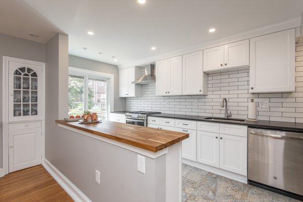 Kitchen remodeling. White shaker cabinets. White subway tile. Wood countertop. Philadelphia, PA.