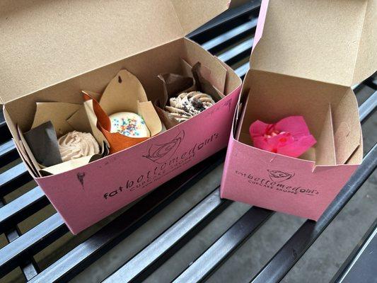 Box of 3 cupcakes and an icing shot, showing some of the excessive packaging use, we ate in the store.