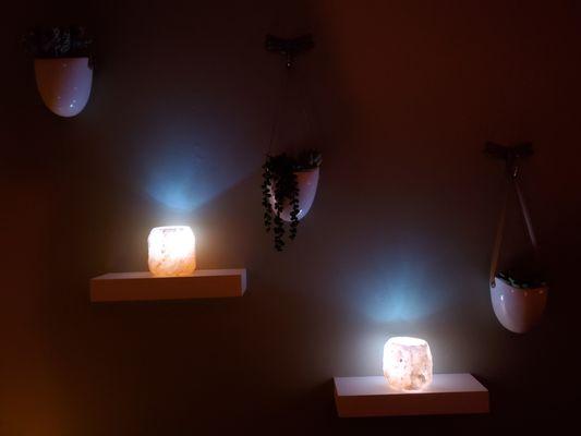 Himalayan Salt tea light holders giving off a soft glow in the Massage Room.