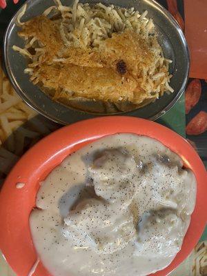 Biscuits and gravy with hash browns.