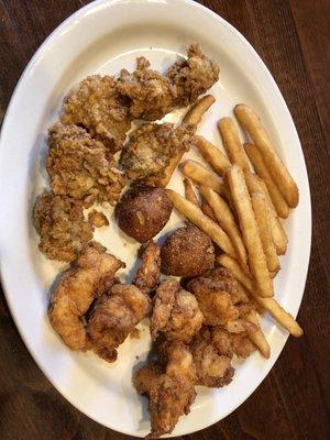 Fried oysters and fried shrimp entree with hush puppies !!