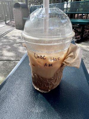 Iced latte with chocolate and hazelnut syrup, and almond milk