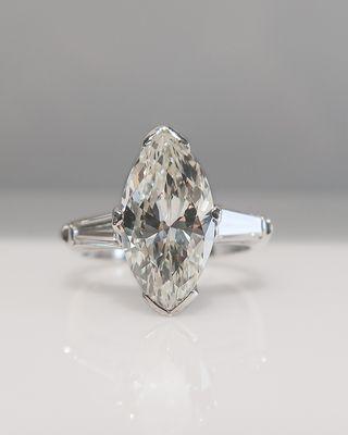 Marquise magic! Custom made vintage inspired marquise diamond 3 stone engagement ring with tapered baguettes!