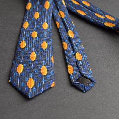 Handmade Blue necktie with yellow oval design.