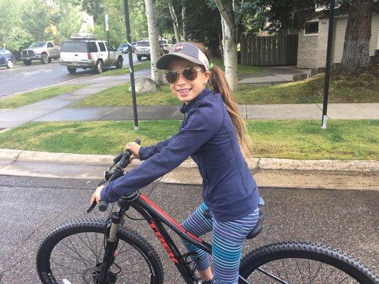 Someone loves her new bike.