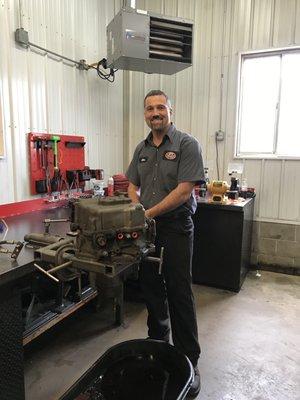 Mike Root inspecting a rebuild.