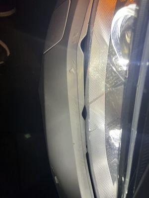 Damage around the headlights to the bumper