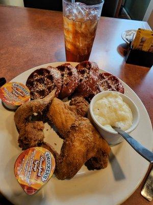 Red Velvet Waffles, chicken wings, grits and sweet tea.