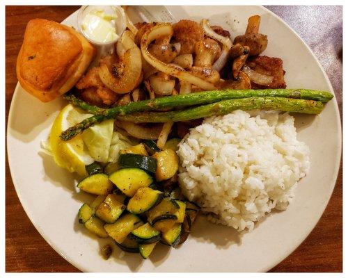 Under all the onions  and mushrooms is a pile of fried Razor Clams.