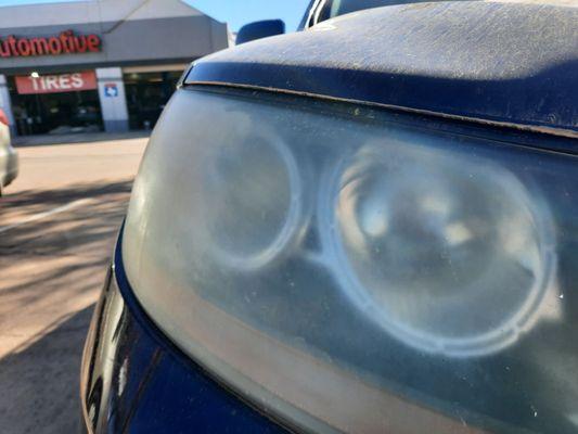 Foggy and scratched headlight.