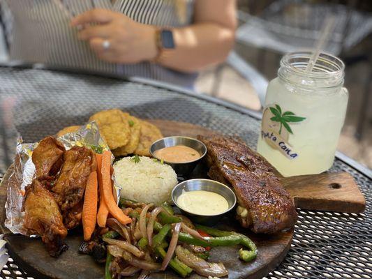 Ribs  Chicken wings  Grilled veggies  Tostones  Rice  Lemonade