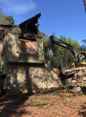 Demo a house after it had burned.