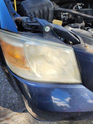 Right Headlight BEFORE Restoration. Terrible.