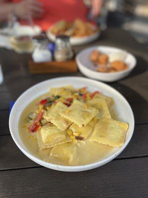 Seafood Tortelli, lobster and crab stuffed pasta, roasted peppers, Marsala corn cream.