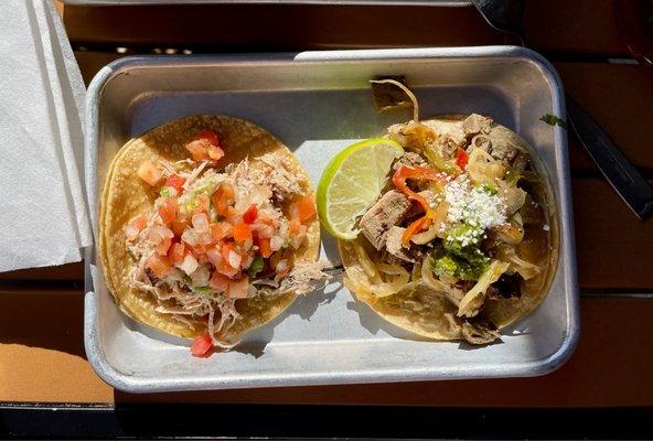 Carnitas taco and a Carne Asada taco.