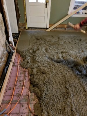 Radiant heat! Here's a picture of us pouring a pad in a basement!