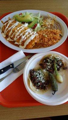 Smothered burrito plate (his) and two $1 barbacoa tacos (mine)