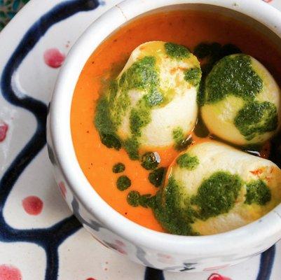 Marshmallow Soup: Tomato and carrot bisque topped with floating mini goat cheese soufflés drizzled with pesto