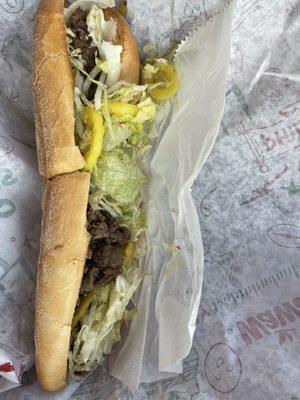 Beef steak with lettuce onions and grilled peppers