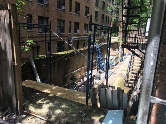 Loss of backyard and massive floods from above and below when construction started.  Fence (above) never re-secured correctly.