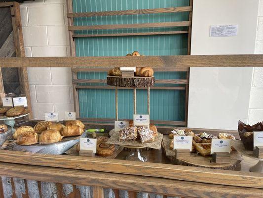 Pastries include muffins, croissants and cinnamon rolls.