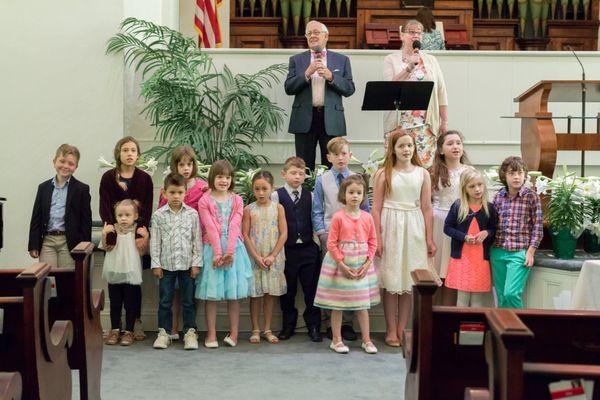 Children join in on the children's song.