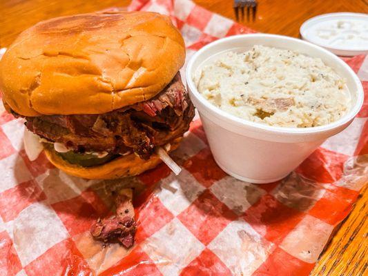 Sliced brisket sandwich & potato salad