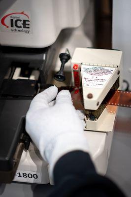 Passing film through the static vacuum on its way into the Noritsu scanner.