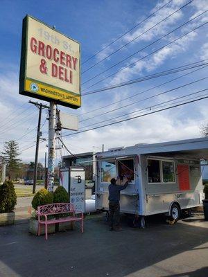 In the parking lot and food truck