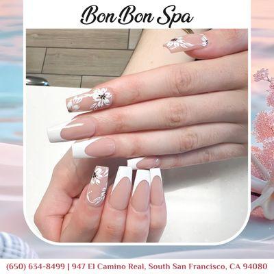 Obsessed with my new nails! This classic French manicure with a floral twist is the perfect way to add a touch of elegance to any outfit.