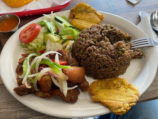 Fried Goat, Plantains, (Brown) Rice and Beans, and salad.